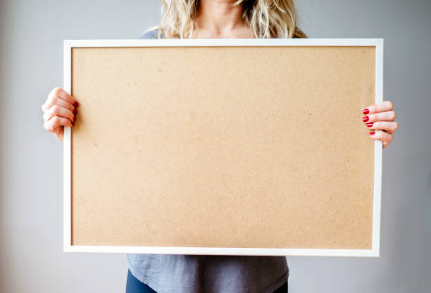 istock Young woman holding white frame ,blank billboard 1282457022