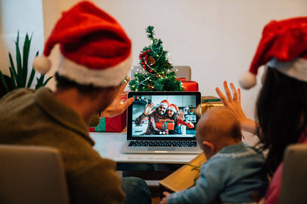 istock Family is celebrating Christmas with their relatives during a video call 1282457230