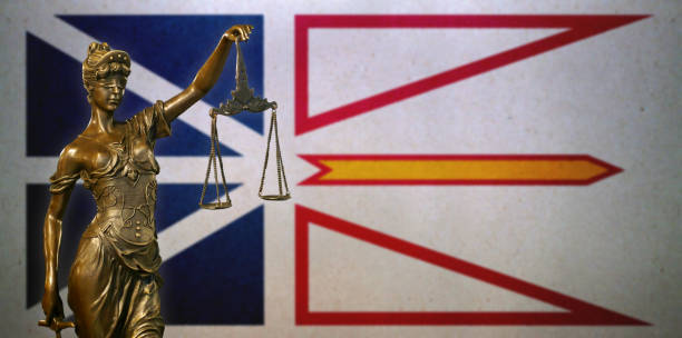 istock Lady Justice before a flag of Newfoundland and Labrador 1282458392