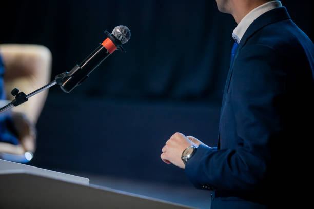istock The people is using the microphone to perform the public speaking. 1282459788