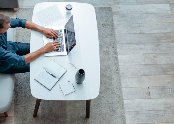 istock young man is working on a laptop in his apartment 1282464037