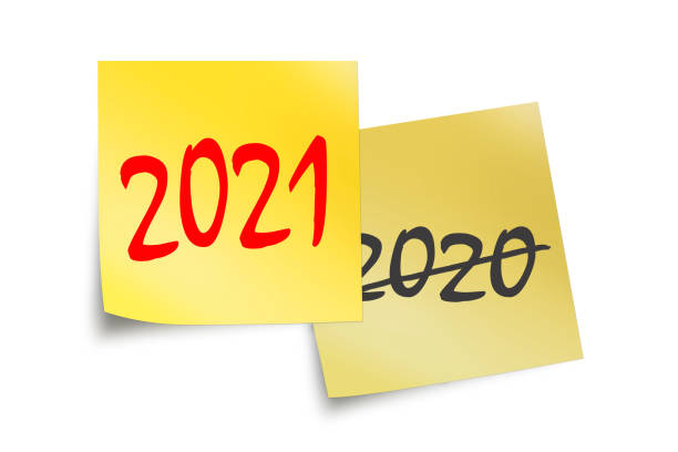 istock 2021 and 2021 written on yellow sticky notes isolated on white 1282465281
