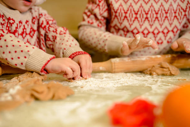 istock Child hands preparing dough for Christmas cookies. Homemade baking 1282467005