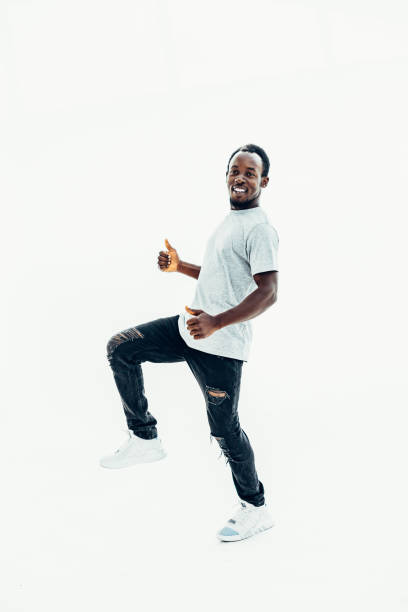 istock side view. smiling handsome guy showing thumbs up 1282467766