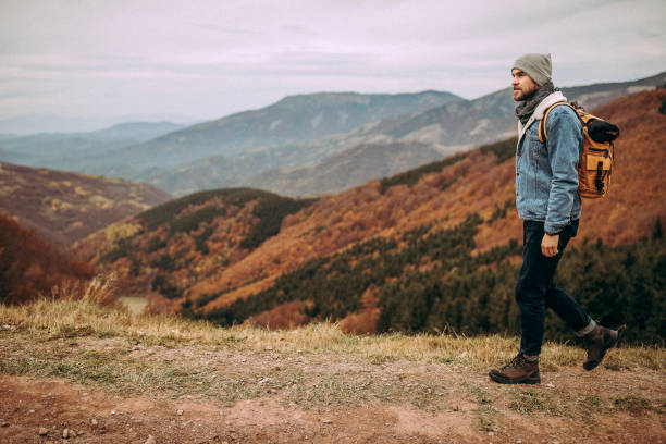 istock Young man hiker climbing up the hill 1282468059