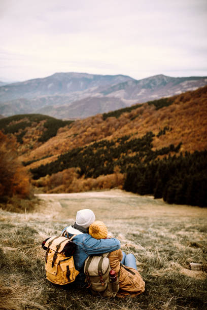 istock Young hiker couple enjyoing their view at mountain top 1282468092