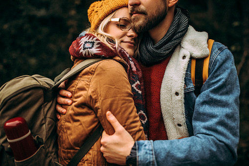 Romantic young couple hiking in mountain together