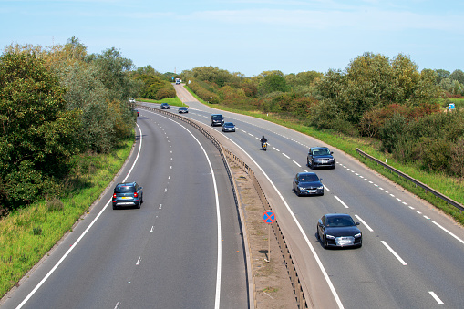 Cromwell, UK - September 13th 2020: Vehicles travelling north and south in summer on the A1 major trunk road near Cromwell in Nottinghamshire, UK