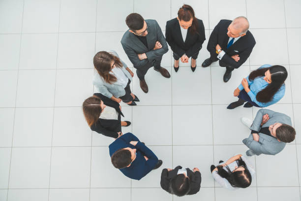 istock top view. group of business people standing in a circle 1282469107