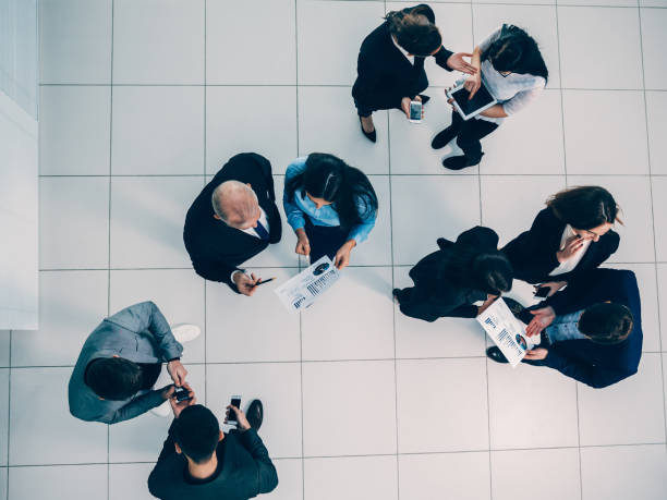 istock top view. a group of employees discussing financial data 1282469375