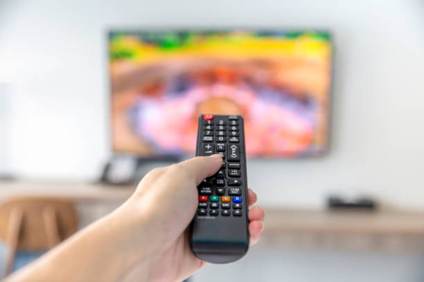 istock The man with the remote control watching TV and using remote controller and presses the button 1282469684