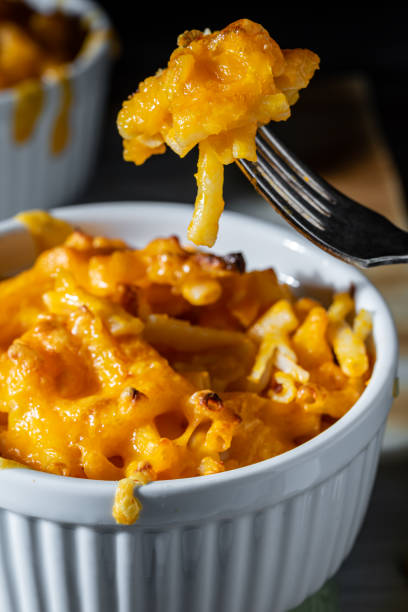 istock Baked macaroni and cheese on the tip of a fork. 1282470624