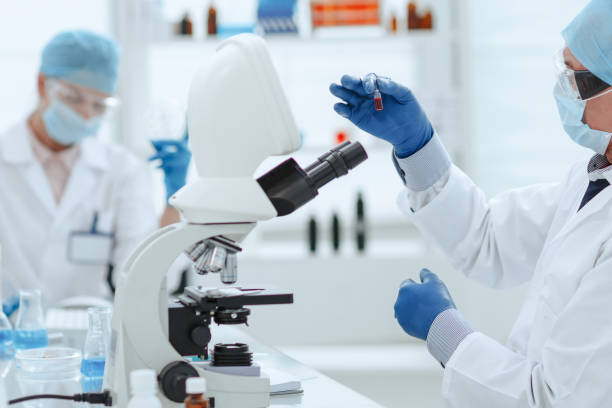 istock scientist opening an ampoule with a new vaccine 1282472246