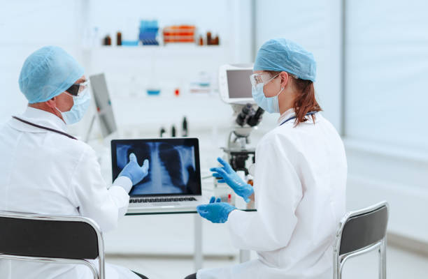 istock close up. doctors discussing a chest x-ray 1282472339