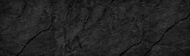 istock Black white background. Black rock texture with veins and cracks. Marble effect. Stone wall background. 1282475549