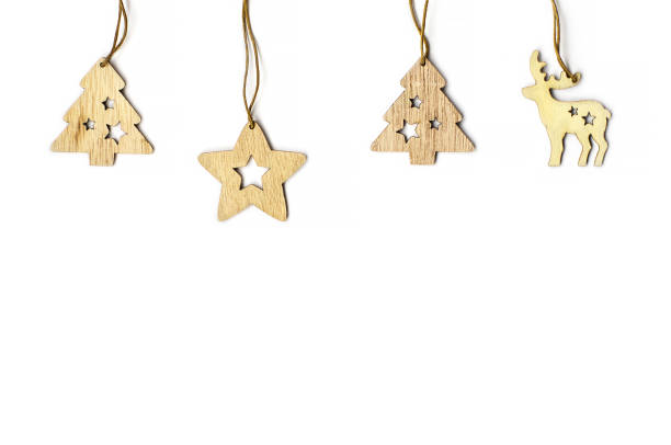 istock small wooden Christmas tree toys on a white background 1282476887