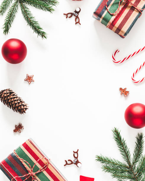 istock Christmas composition. Christmas gifts, fir tree branches, decorations on white background. Flat lay, top view, copy space 1282477002