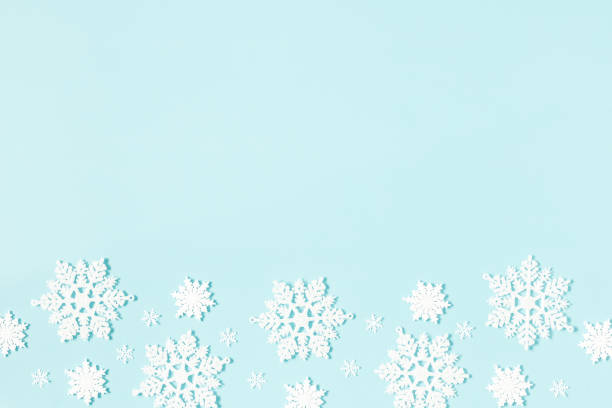 istock Christmas or winter composition. Pattern made of snowflakes on pastel blue background. Christmas, winter, new year concept. Flat lay, top view, copy space 1282477051