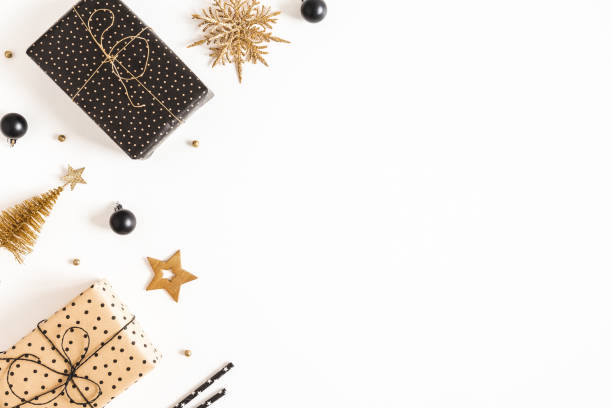 istock Christmas composition. Gift boxes, black and golden decorations on white background. Christmas, winter, new year concept. Flat lay, top view, copy space 1282477070