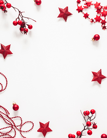 Christmas red decorations on white background. Christmas, new year, winter concept. Flat lay, top view, copy space