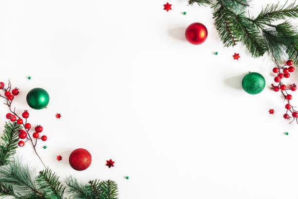 Christmas composition. Fir tree branches, red and green decorations on white background. Christmas, winter, new year concept. Flat lay, top view, copy space
