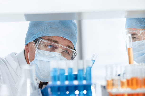 istock close up. scientists discussing the results of testing a new vaccine 1282477543