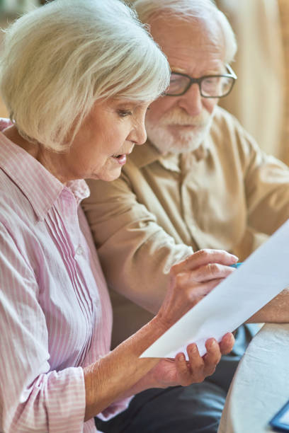 istock Elderly husband and wife discussing budget planning 1282480406