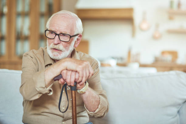istock Concentrated male pensioner spending time at his house 1282481034