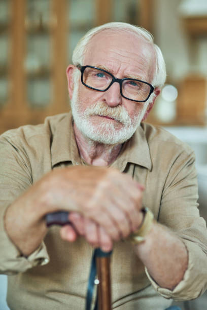 istock Calm male pensioner focused looking at the camera 1282481046
