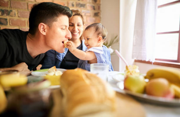 istock Cute little family at breakfast table 1282481206