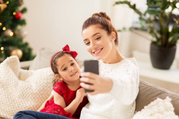 istock family taking selfie by smartphone at home 1282481830