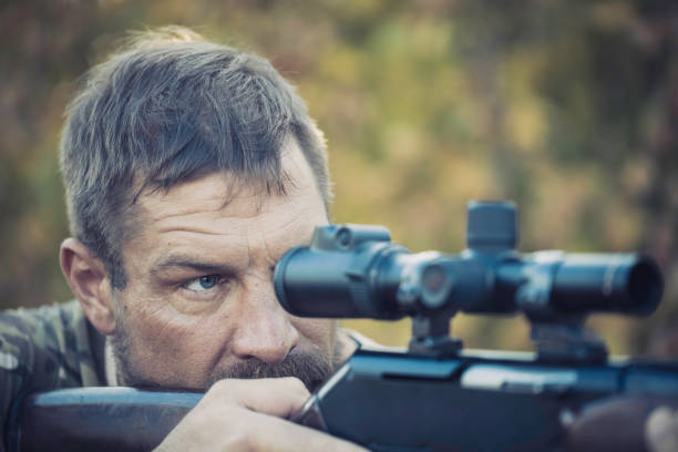 istock Close up image of male shooting rifle 1282483408