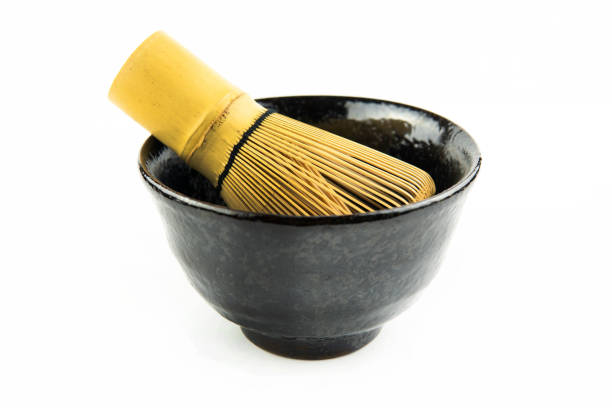 istock Japanese matcha set clay bowl with bamboo whisk on white background 1282484189