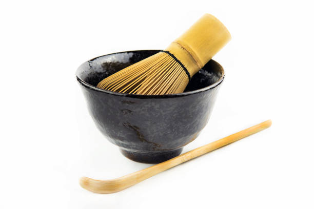 istock Japanese matcha set clay bowl with bamboo whisk on white background 1282484216