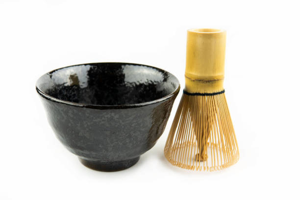 istock Japanese matcha set clay bowl with bamboo whisk on white background 1282484230