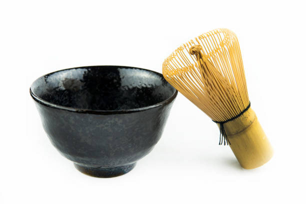 istock Japanese matcha set clay bowl with bamboo whisk on white background 1282484245
