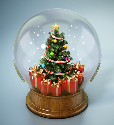 Christmas tree and gifts inside snowglobe.