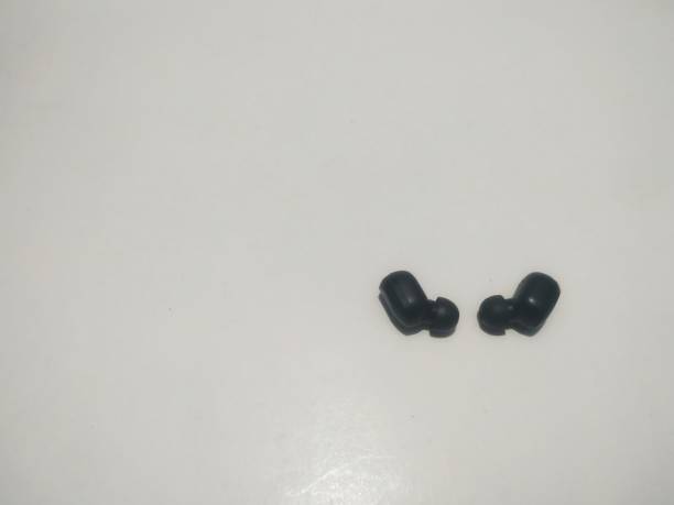 istock a pair of black earplug 1282484860