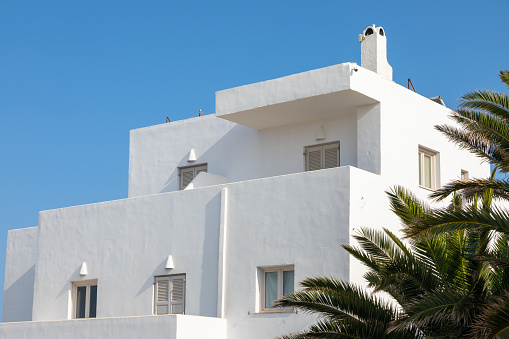 White balusters against the blue sky. A fragment of classical architecture.