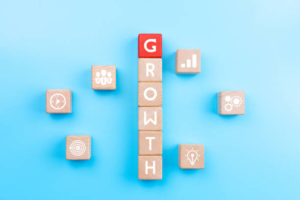 istock Action plan and Business process management concept, wooden blocks with word GROWTH and business strategy icons on blue background 1282485722