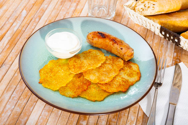 istock Potato pancakes with sausage and sour cream 1282487646