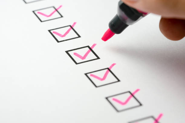 istock Pink marking on checklist box with pen, Checklist concept 1282487931