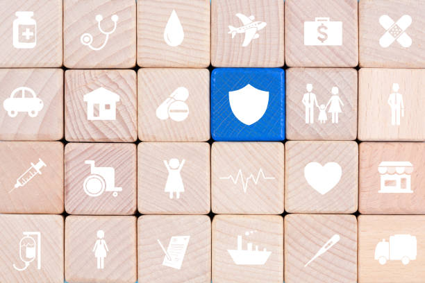 Wooden blocks with insurance icons. family, life, car, travel, health and house insurance icons, Insurance concepts stock photo