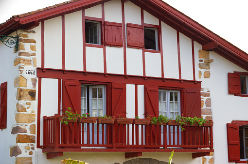 Typical house of the Basque country in the village of Ainhoa, with its bright red colors and half-timbered