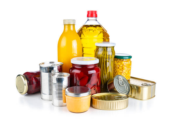 non-perishable food: canned goods, conserves, sauces and oils isolated on white background - non perishable imagens e fotografias de stock