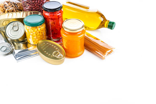 istock Non-perishable food: canned goods, conserves, sauces and oils on white background. Copy space 1282490232