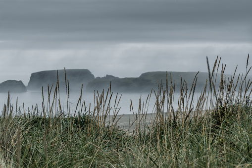 A foggy autumn morning off the coast of St Ninian Island in Shetland.