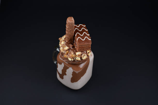 istock Chocolate extreme milkshake with brownie cake, chocolate paste and sweets. Crazy freakshake food trend. Copy space 1282490465