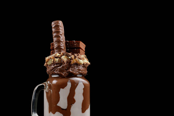 istock Chocolate extreme milkshake with brownie cake, chocolate paste and sweets. Crazy freakshake food trend. Copy space 1282490469