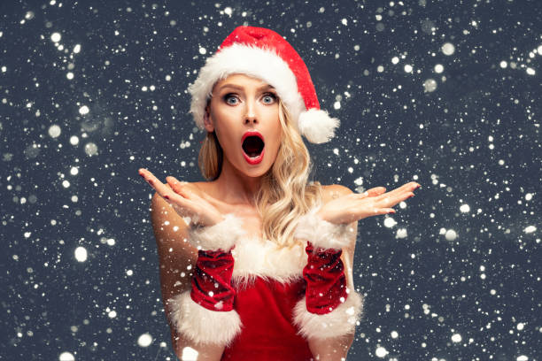istock Beautiful Santa girl in red hat. 1282493973